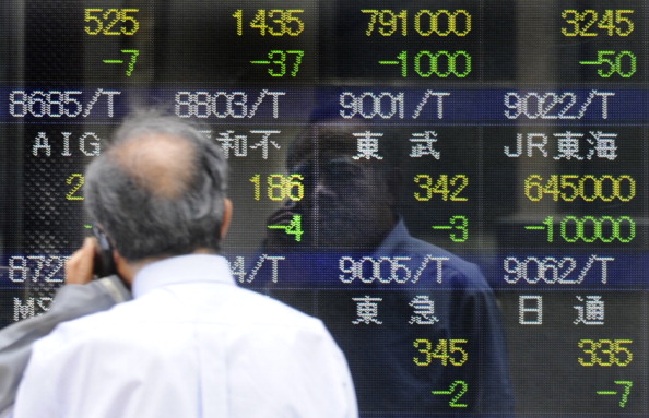 A man looks at an electric quotation boa